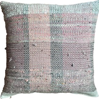 delicate pale pink striped cushion on a natural linen background.