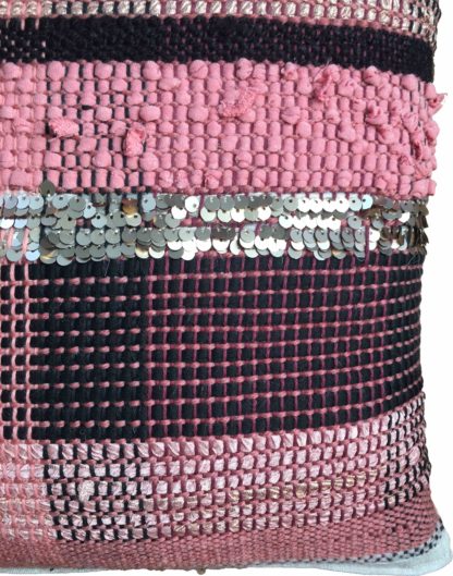 detail of pink and black striped cushion with sequins
